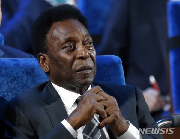 FILE - In this Dec. 1, 2017, file photo, Brazilian soccer legend Pele attends the 2018 soccer World Cup draw in the Kremlin in Moscow. Pele has successfully undergone surgery for the removal of a kidney stone in a Sao Paulo hospital.  The Albert Einstein Hospital said on its website Saturday, April 13, 2019, that Pele's surgery went well, but did not provide additional details. (AP Photo/Alexander Zemlianichenko, File)